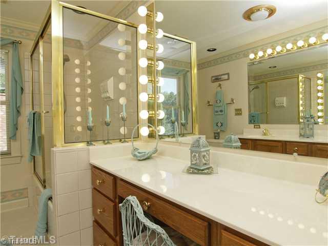 6102 Pintail Court Oak Ridge, NC 27310 - Photo 13 of 16 Master Bath/Spa. Double sinks and separate vanity area offer a perfect start for your day. New ceramic flooring was installed in 2011 per the seller.