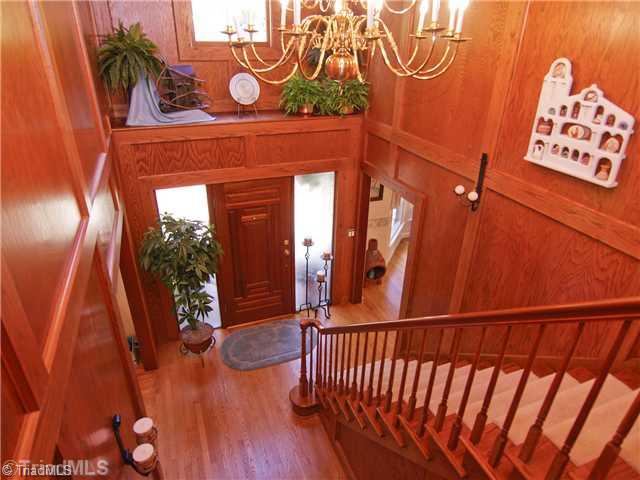 6102 Pintail Court Oak Ridge, NC 27310 - Photo 7 of 16 Entry. The two-story foyer is warm and inviting with solid oak paneling. It sets the stage for this magnificent home.