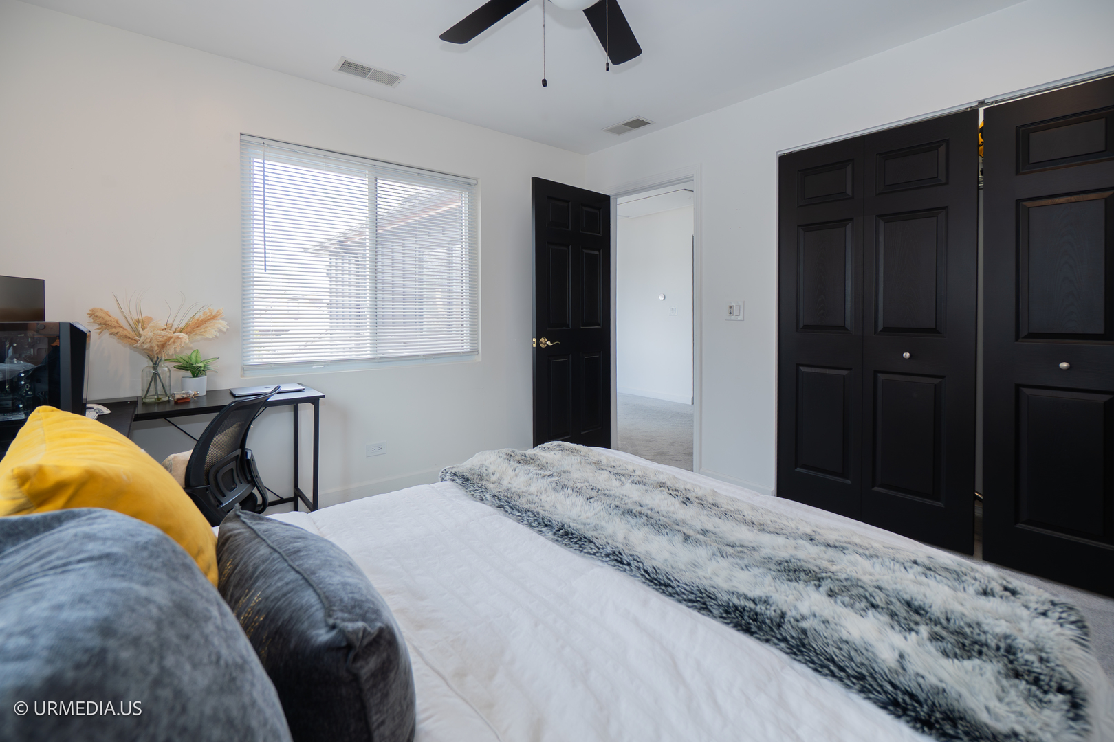 7100 North Sioux Avenue Chicago, IL 60646 - Photo 29 of 49 a bedroom with a bed and a chandelier