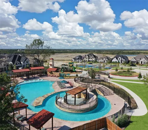 a view of a swimming pool with outdoor seating