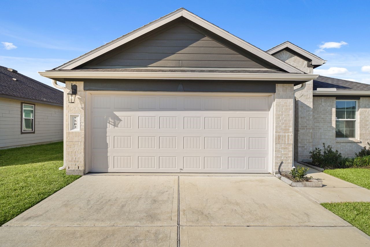 7502 Fierce Friesian Lane Rosharon, TX 77583 - Photo 2 of 21 a front view of a house with a yard and garage
