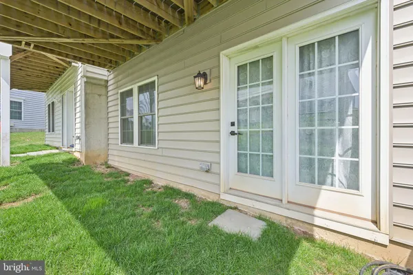 a view of house with backyard