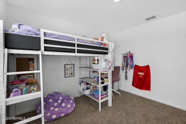a bedroom with a bed and closet