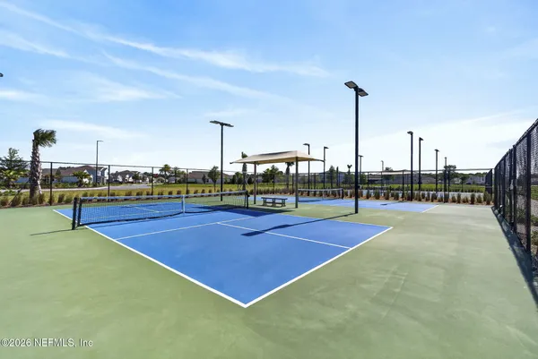 a view of an outdoor space and tennis court