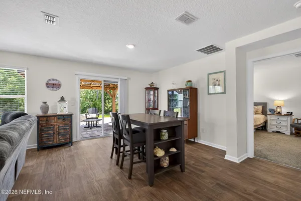 a view of a livingroom with furniture window and wooden floor