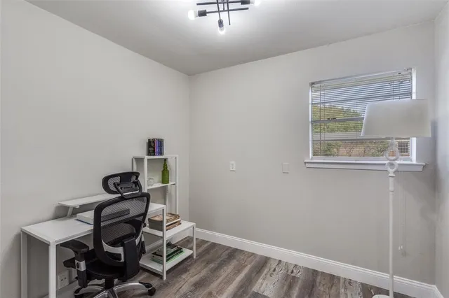 a view of workspace with wooden floor