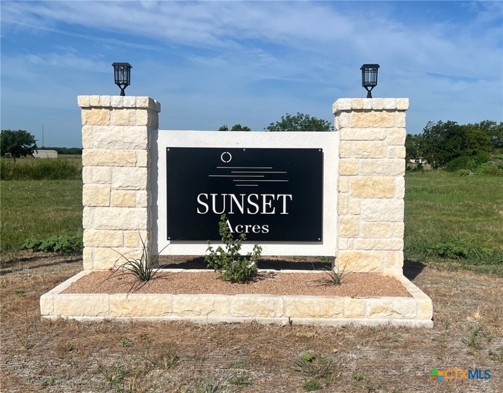 8104 Evenfall Lane Temple, TX 76501 - Photo 4 of 5 a sign board on the side of a building