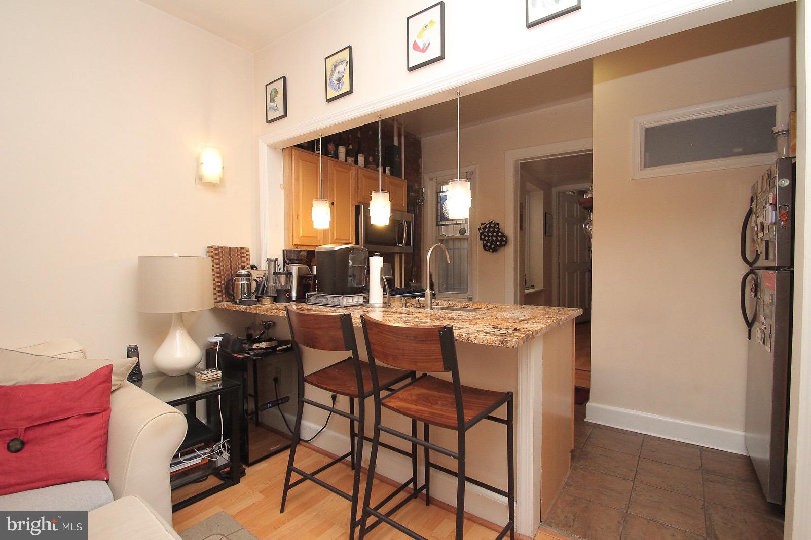 511 South 17th Street, Unit 1 Philadelphia, PA 19146 - Photo 3 of 15 a view of a dining room with furniture and a chandelier