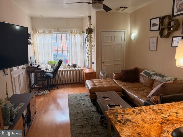 511 South 17th Street, Unit 1 Philadelphia, PA 19146 - Photo 4 of 15 a living room with furniture and a flat screen tv