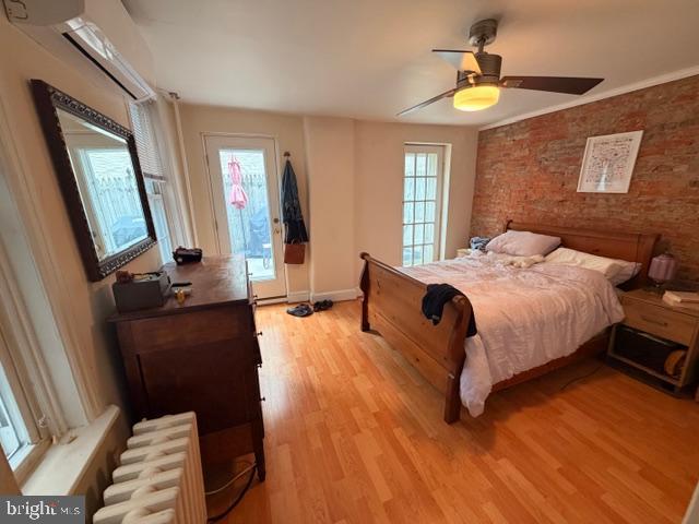 511 South 17th Street, Unit 1 Philadelphia, PA 19146 - Photo 9 of 15 a bedroom with a bed and a chandelier