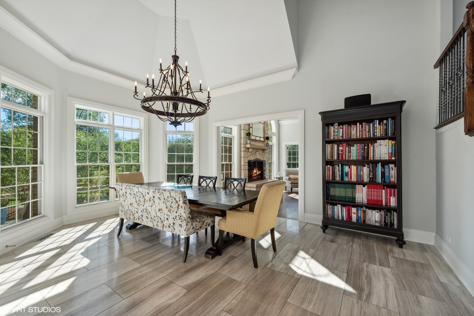 675 Old Barrington Road North Barrington, IL 60010 - Photo 12 of 73 a dining room with wooden floor a chandelier a glass table and chairs