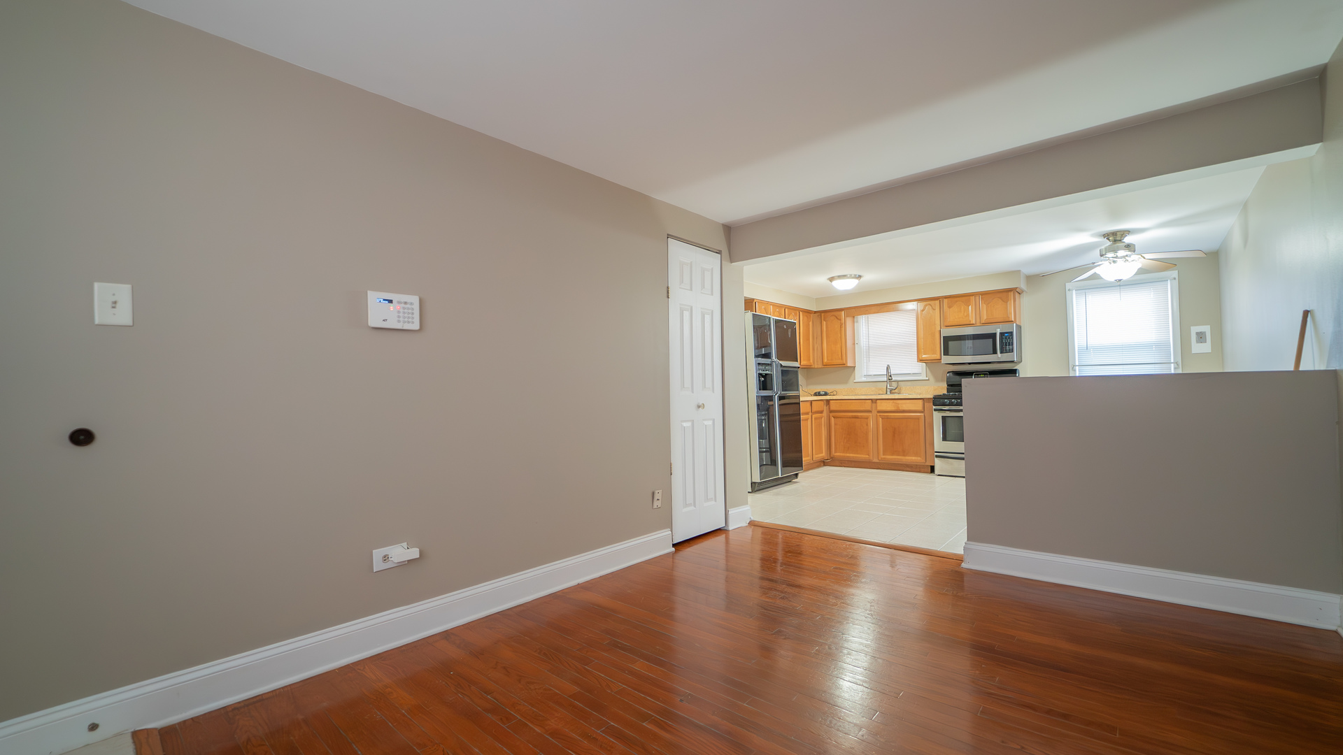 2336 Union Street, Unit 4 Blue Island, IL 60406 - Photo 4 of 12 a view of a kitchen with wooden floor and a kitchen