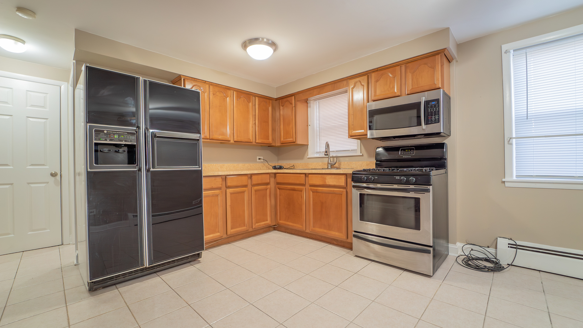 2336 Union Street, Unit 4 Blue Island, IL 60406 - Photo 7 of 12 a kitchen with stainless steel appliances cabinets and a sink