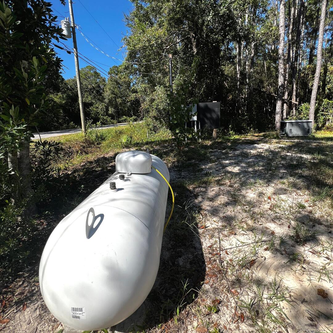 3126 Wells Beach Road Navarre, FL 32566 - Photo 26 of 30 Propane Tank & Home Standby Generator