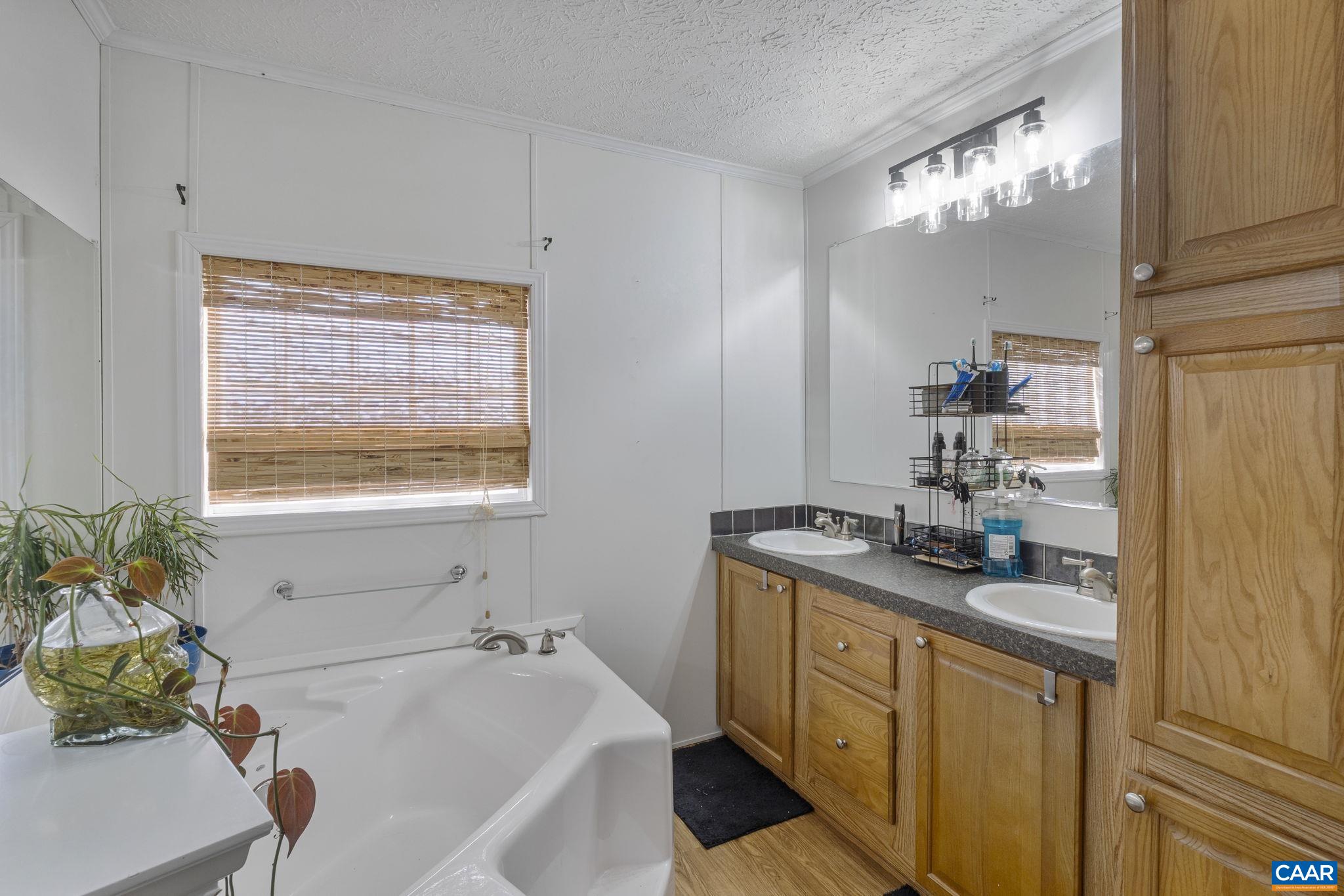 1173 Aylor Road Madison, VA 22727 - Photo 22 of 44 a bathroom with a granite countertop sink a vanity and a mirror