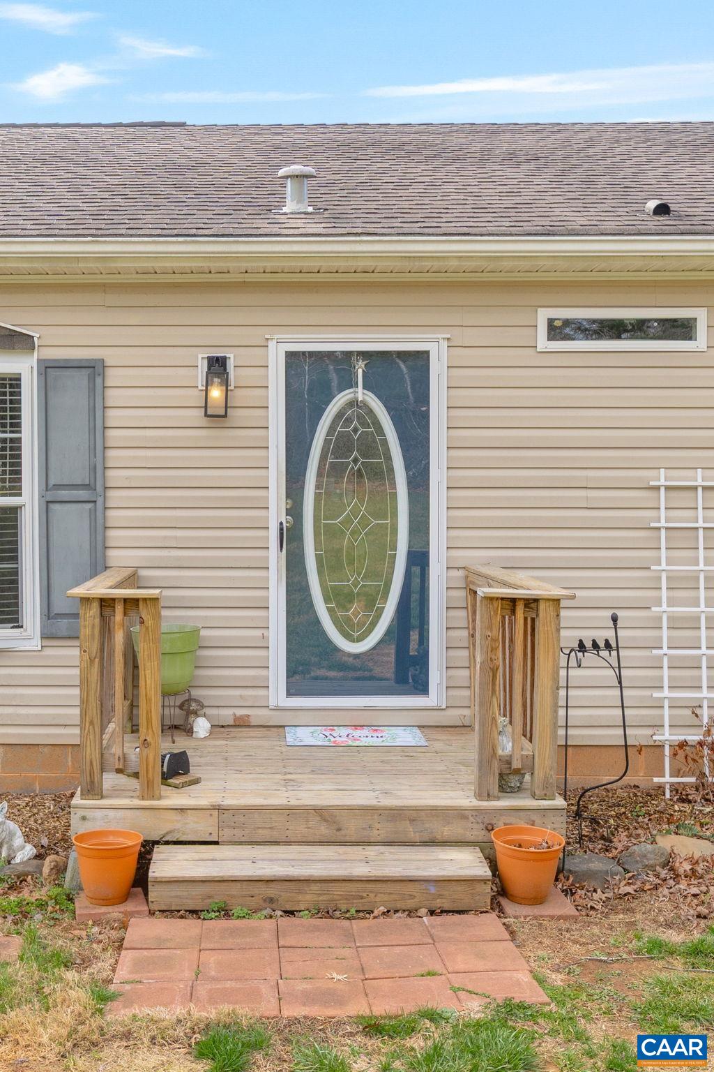 1173 Aylor Road Madison, VA 22727 - Photo 36 of 44 a front view of a house with a garden and a fountain