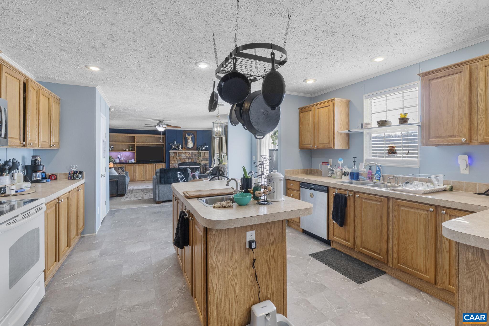 1173 Aylor Road Madison, VA 22727 - Photo 9 of 44 a kitchen with stainless steel appliances granite countertop a sink a stove and a refrigerator