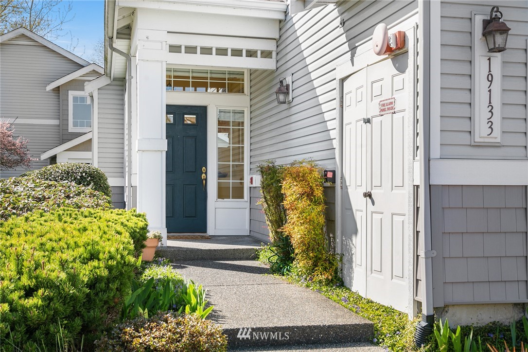 19133 110th Place Southeast Renton, WA 98055 - Photo 2 of 17 a front view of a house with a garden