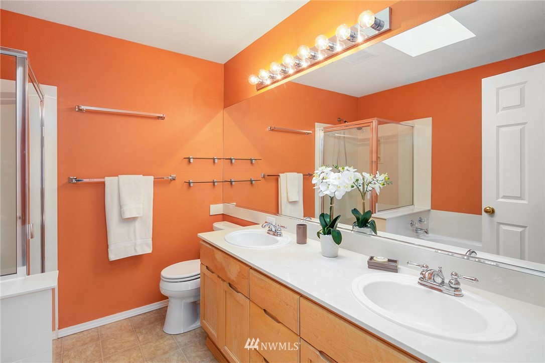 19133 110th Place Southeast Renton, WA 98055 - Photo 12 of 17 a bathroom with a sink and a mirror