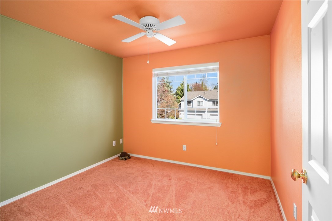 19133 110th Place Southeast Renton, WA 98055 - Photo 13 of 17 an empty room with a window and a ceiling fan