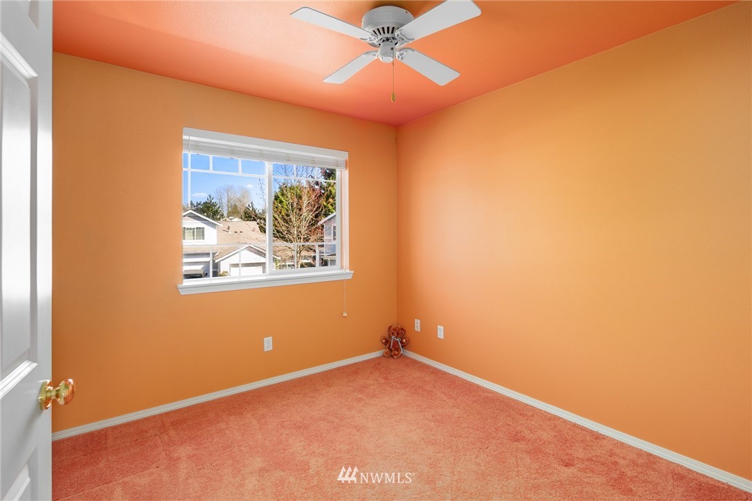 19133 110th Place Southeast Renton, WA 98055 - Photo 14 of 17 an empty room with a window and a ceiling fan