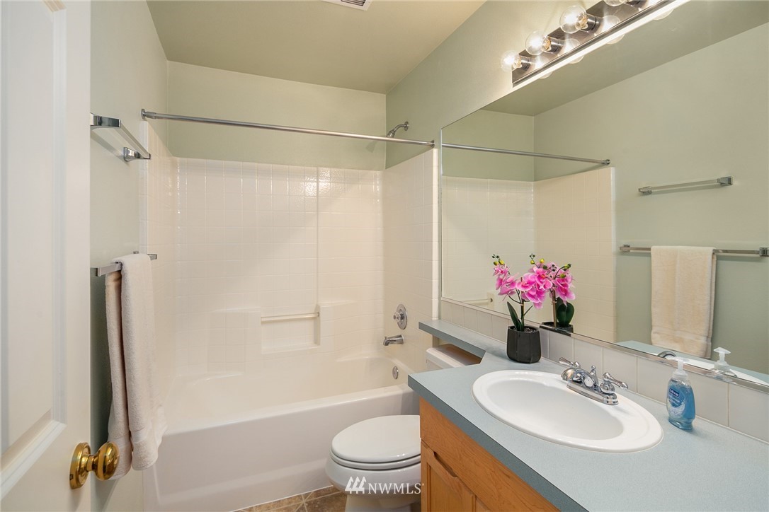 19133 110th Place Southeast Renton, WA 98055 - Photo 15 of 17 a bathroom with a sink toilet and shower