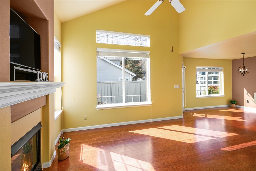 19133 110th Place Southeast Renton, WA 98055 - Photo 3 of 17 a view of an empty room with a fireplace and a window
