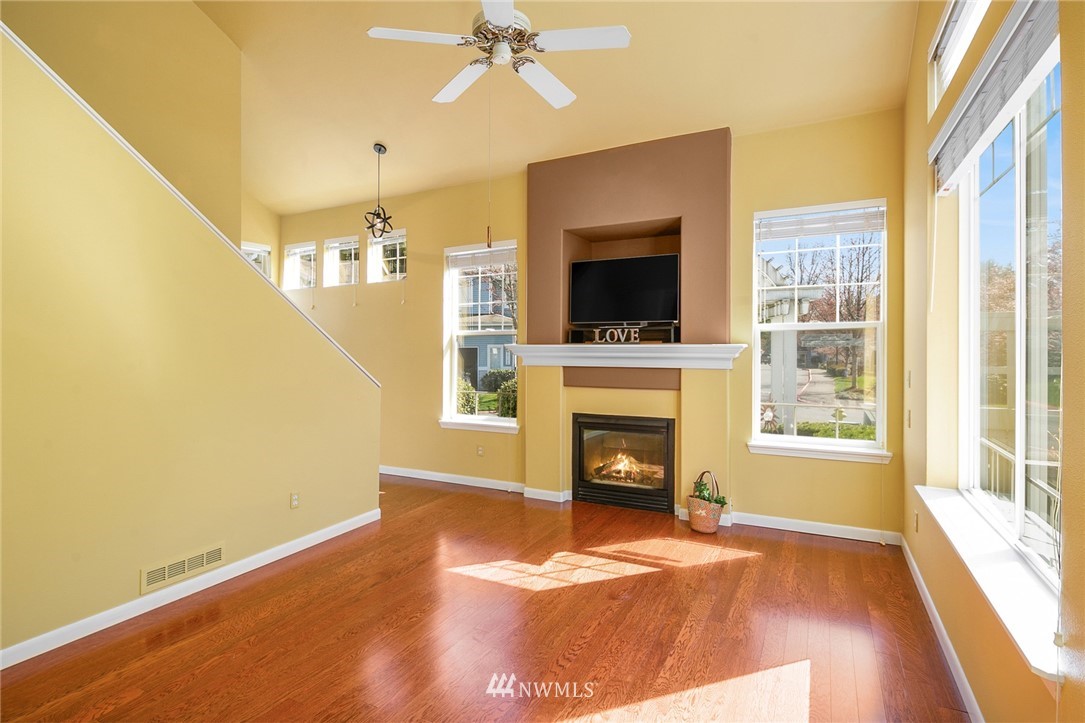 19133 110th Place Southeast Renton, WA 98055 - Photo 4 of 17 a view of an empty room with a fireplace and a window
