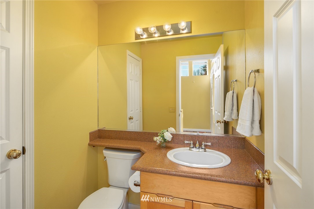 19133 110th Place Southeast Renton, WA 98055 - Photo 10 of 17 a bathroom with a sink and a mirror