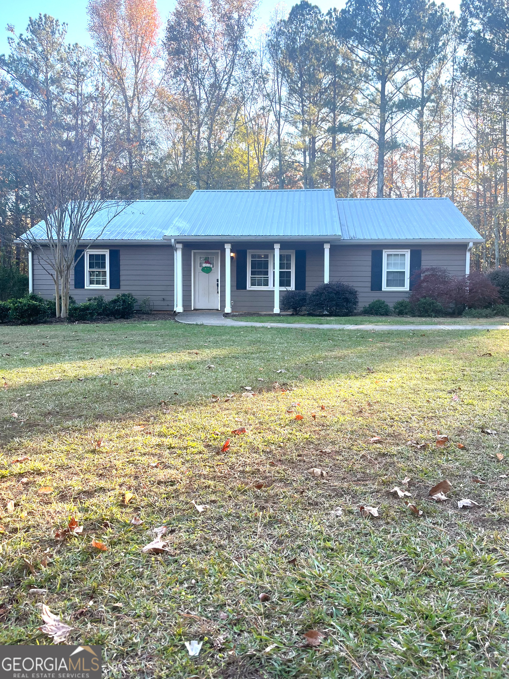 703 Hickman Fork Road Thomaston, GA 30286 - Photo 1 of 1 a view of a house with a yard