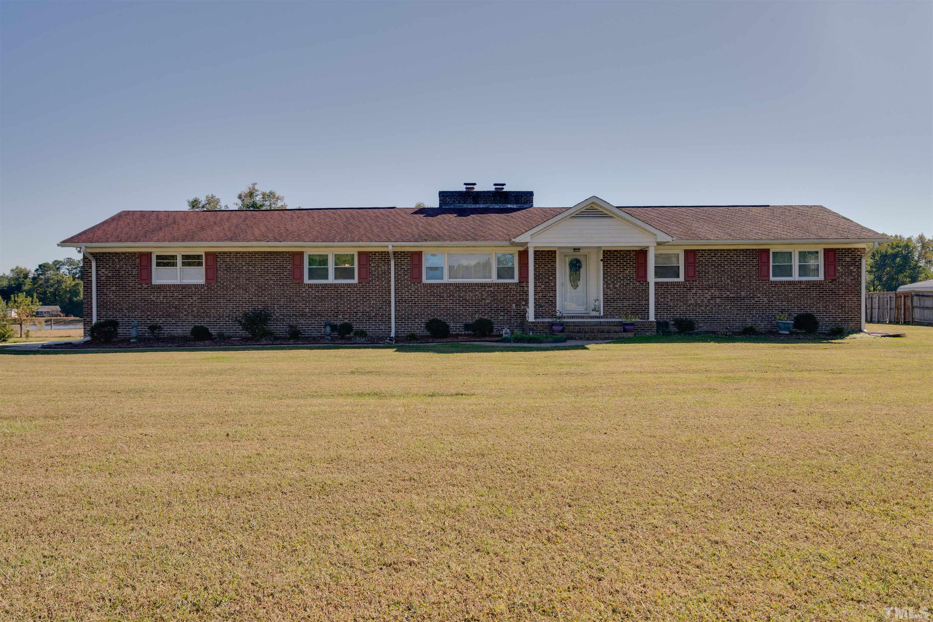245 Pilot-Riley Road Zebulon, NC 27597 - Photo 1 of 22 a front view of a house with a yard