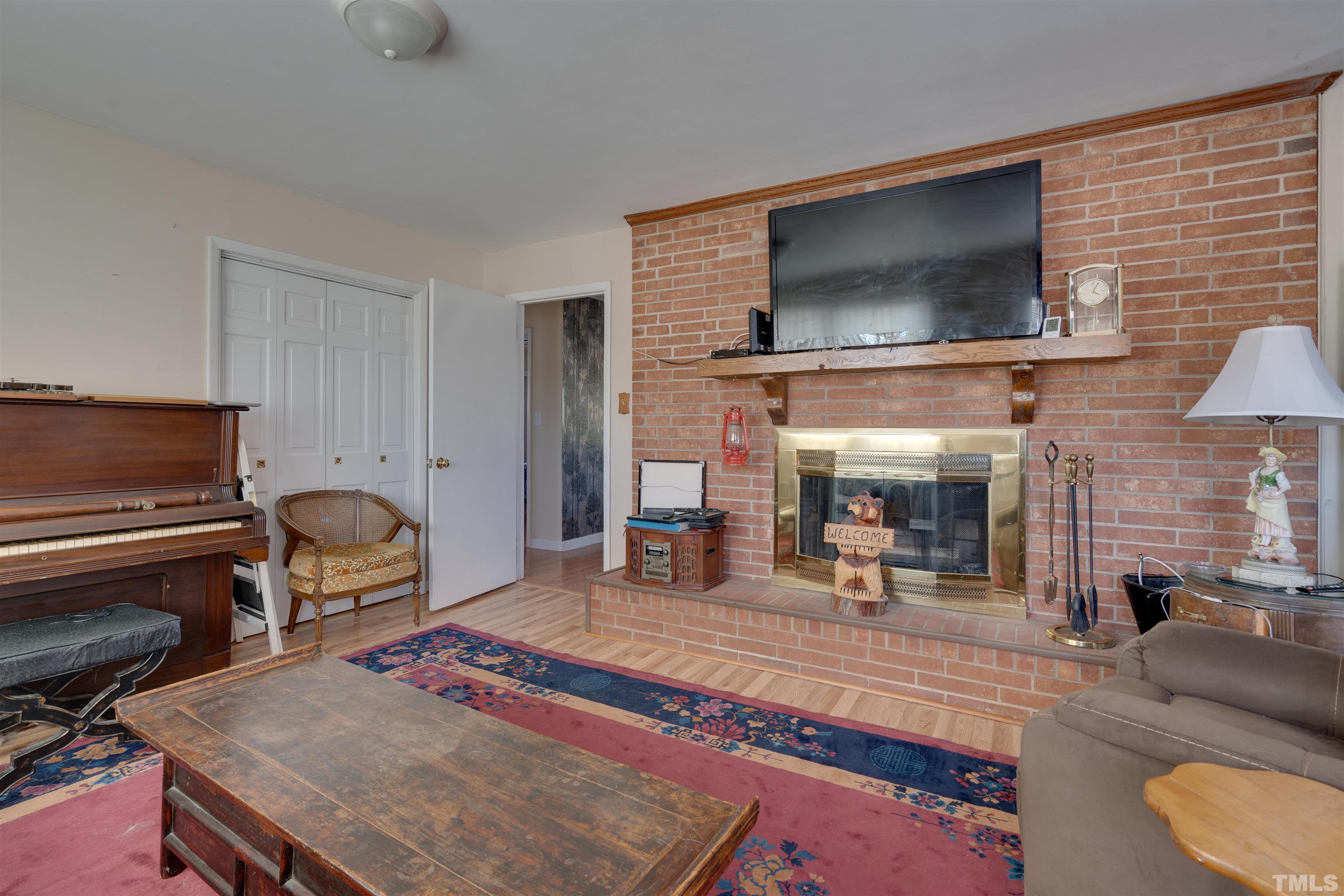 245 Pilot-Riley Road Zebulon, NC 27597 - Photo 12 of 22 a living room with furniture and a flat screen tv