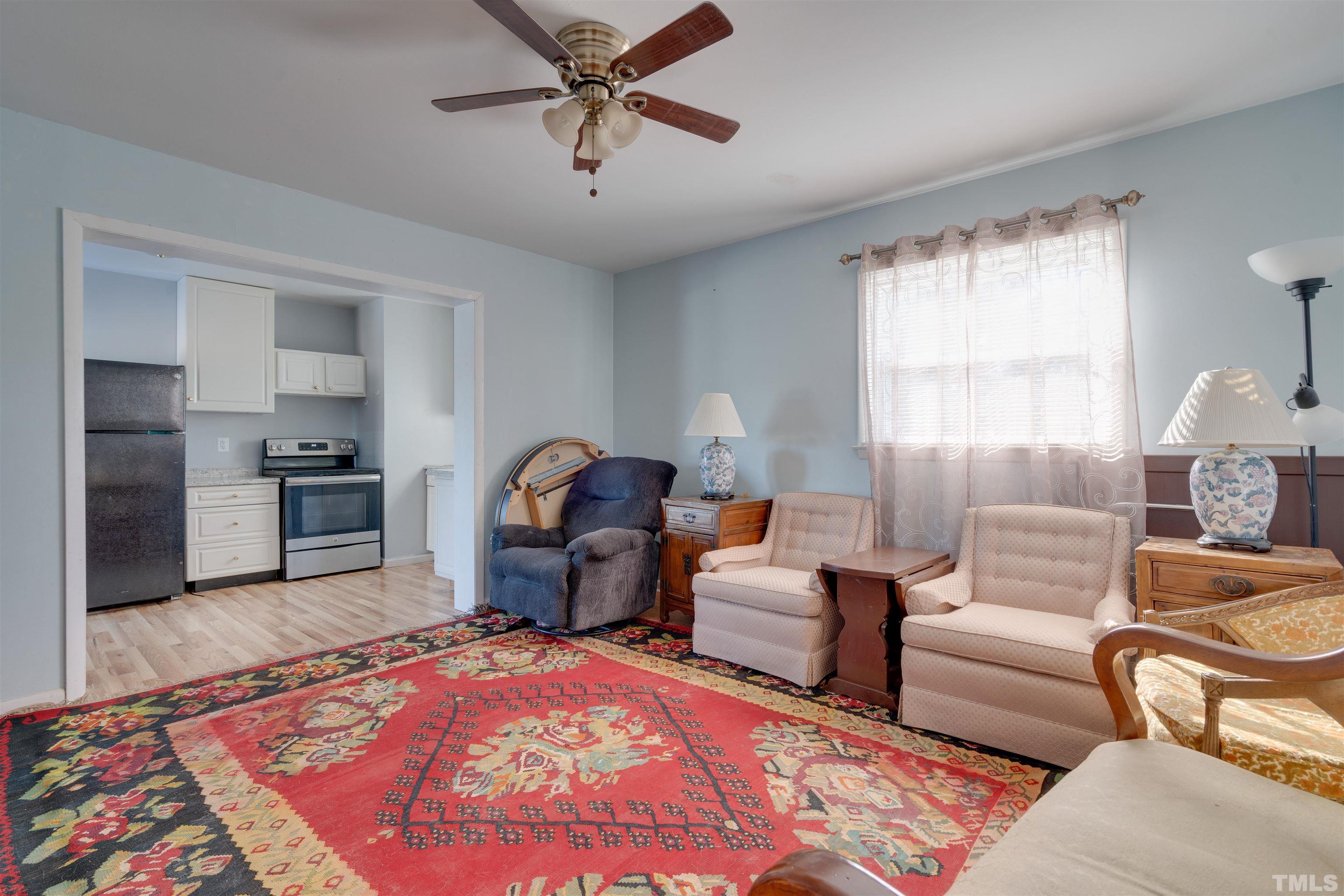 245 Pilot-Riley Road Zebulon, NC 27597 - Photo 18 of 22 a living room with furniture and a rug