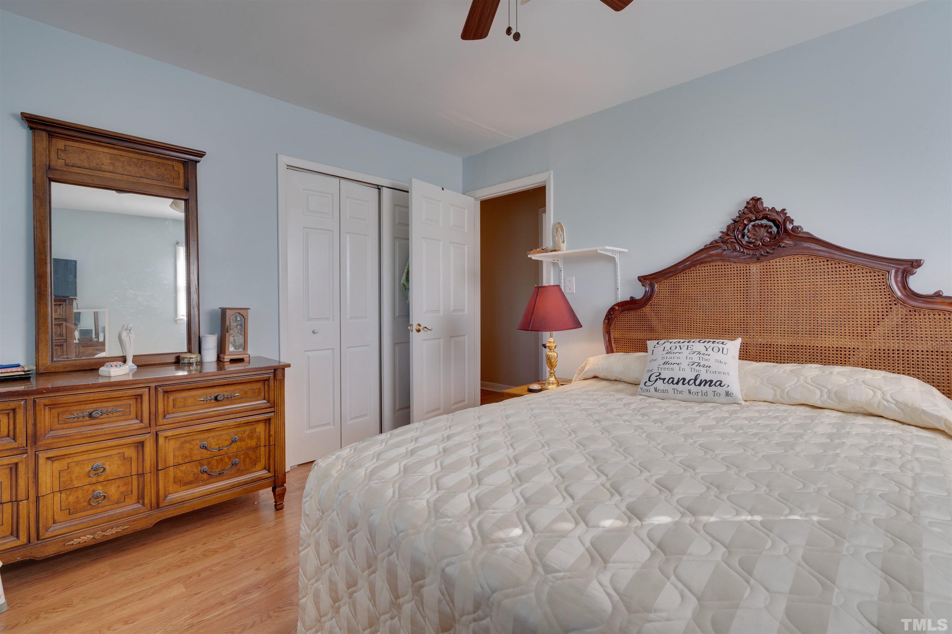 245 Pilot-Riley Road Zebulon, NC 27597 - Photo 19 of 22 a bedroom with a bed and a dresser