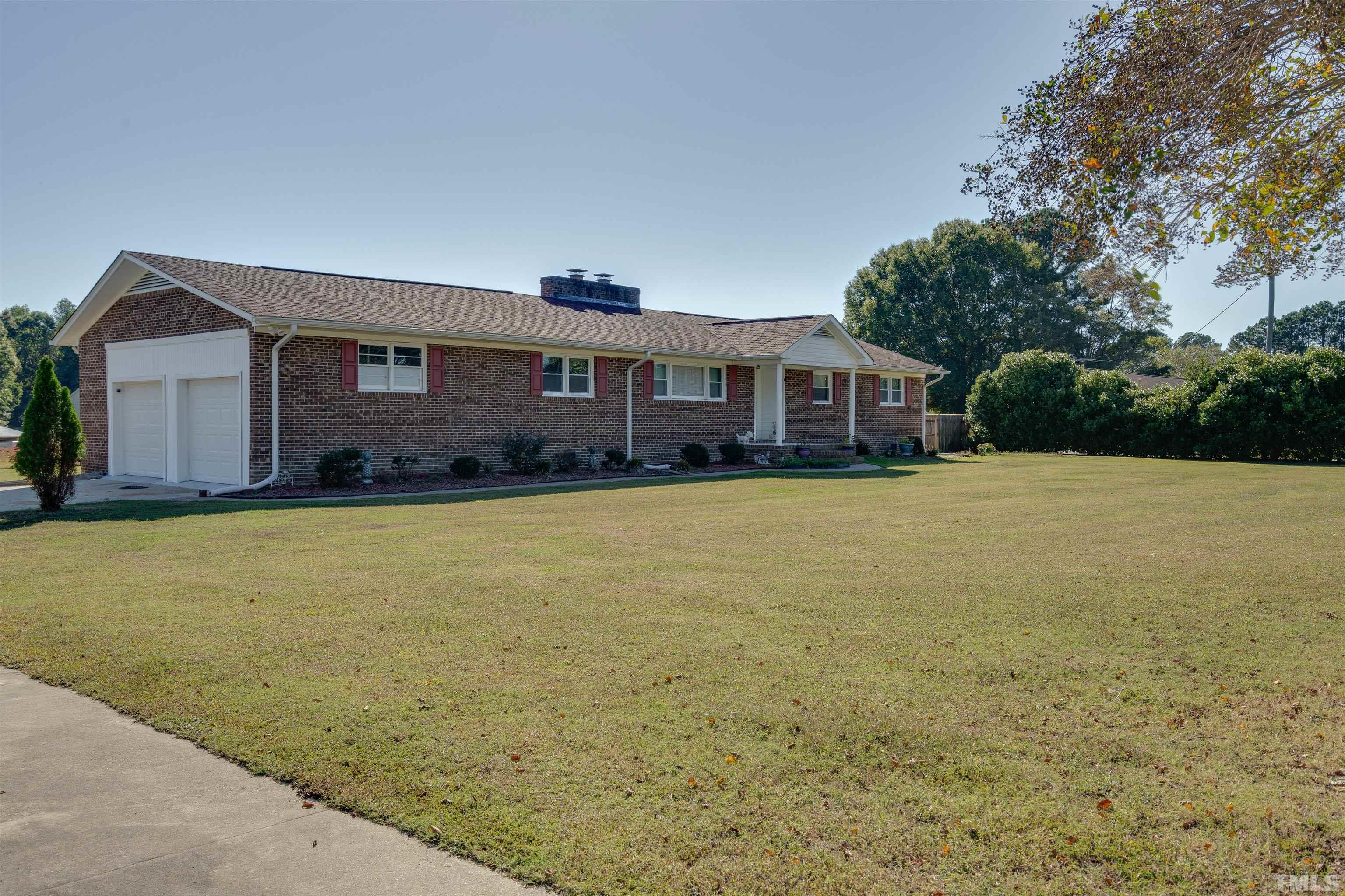 245 Pilot-Riley Road Zebulon, NC 27597 - Photo 3 of 22 a front view of a house with a yard