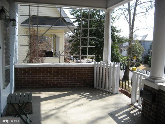 503 Westgate Road Baltimore, MD 21229 - Photo 2 of 24 a front view of a house with a garage