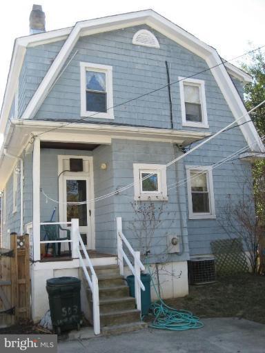 503 Westgate Road Baltimore, MD 21229 - Photo 12 of 24 a front view of a house with stairs
