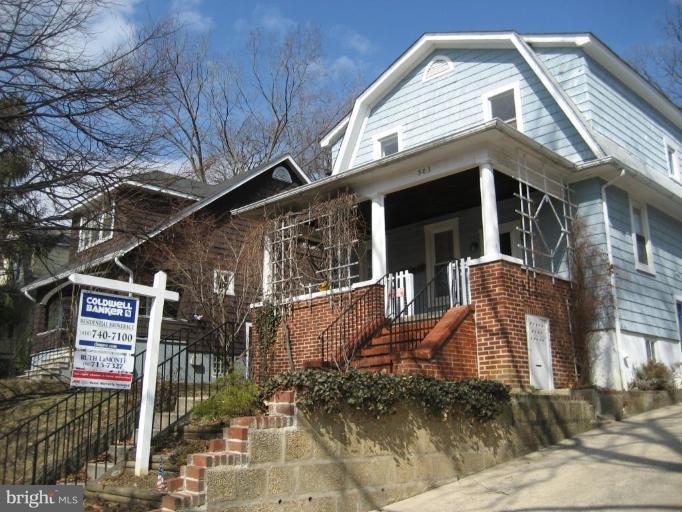 503 Westgate Road Baltimore, MD 21229 - Photo 21 of 24 a front view of a house with garden