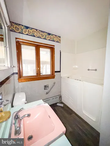 a room with a bed and a window