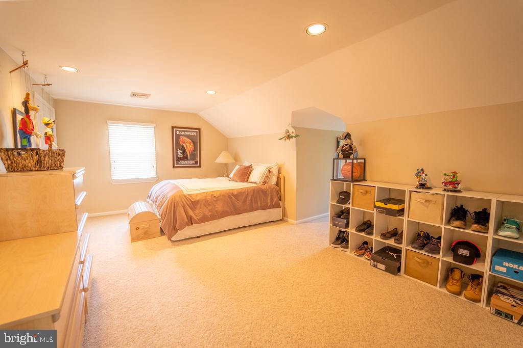 1409 Hampton Road Rydal, PA 19046 - Photo 36 of 50 a spacious bedroom with a bed and a view of living room
