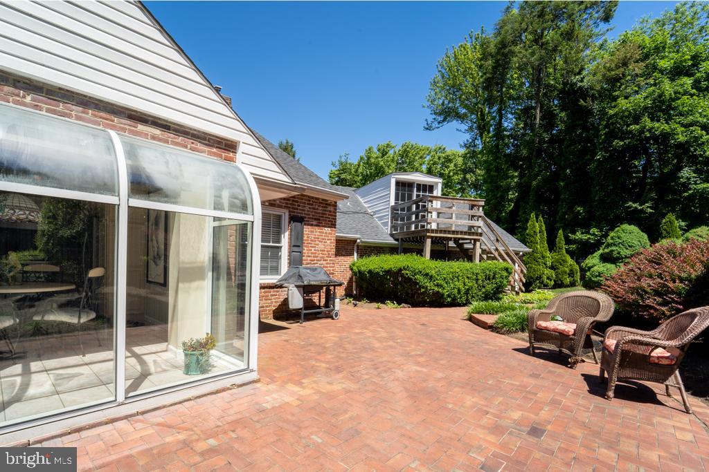 1409 Hampton Road Rydal, PA 19046 - Photo 42 of 50 a view of a patio with a table and chairs under an umbrella