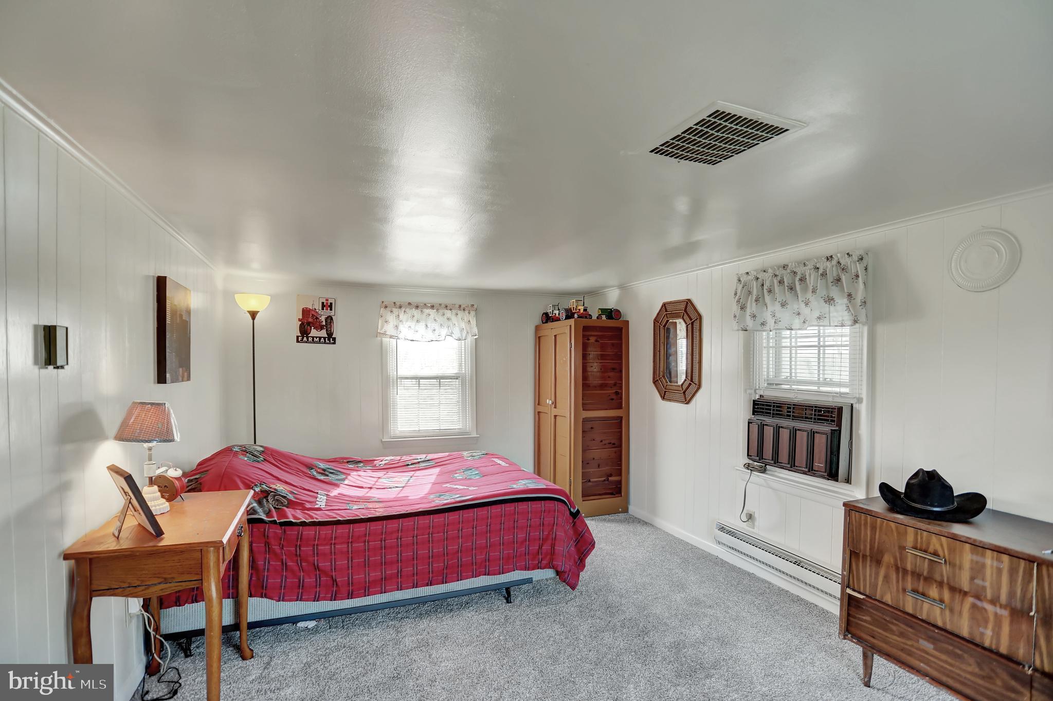 231 Mohawk Road Newville, PA 17241 - Photo 17 of 72 a bedroom with a bed and wooden floor