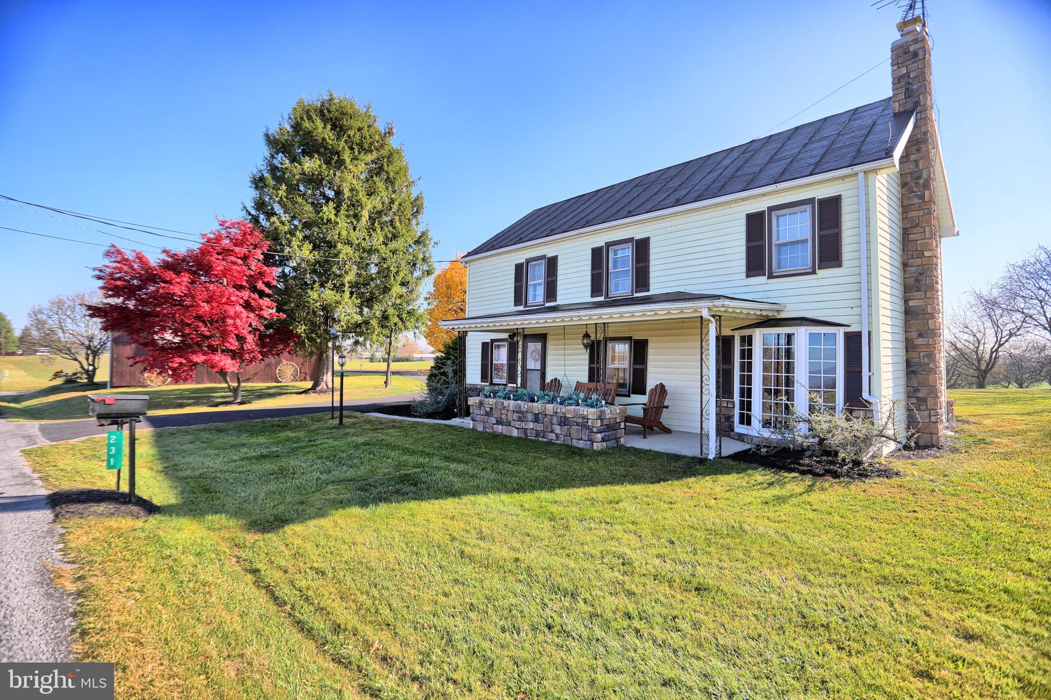 231 Mohawk Road Newville, PA 17241 - Photo 3 of 72 a front view of a house with a yard table and chairs