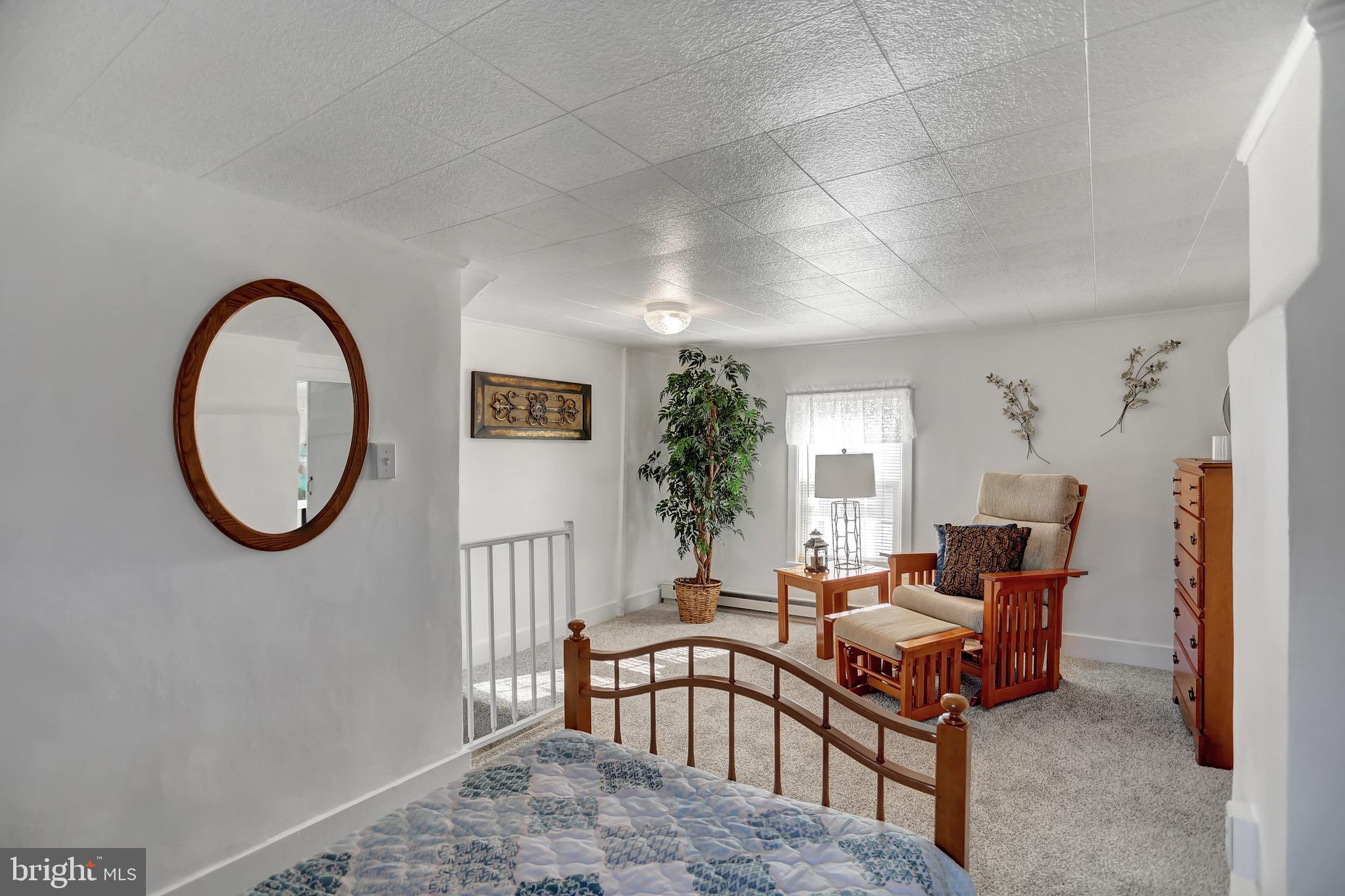 231 Mohawk Road Newville, PA 17241 - Photo 24 of 72 a living room with furniture a window and a potted plant