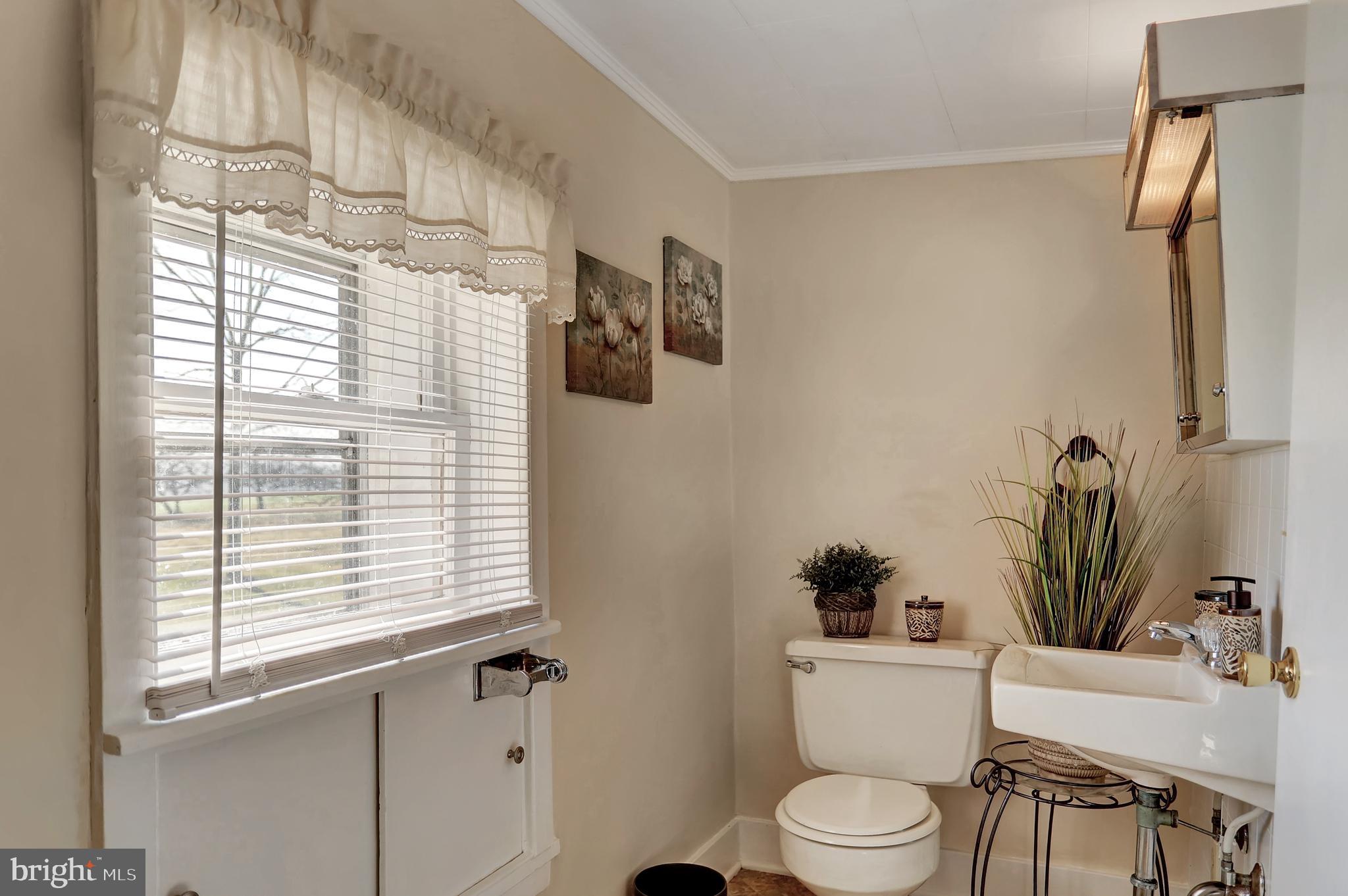 231 Mohawk Road Newville, PA 17241 - Photo 28 of 72 a bathroom with a toilet a sink and a window