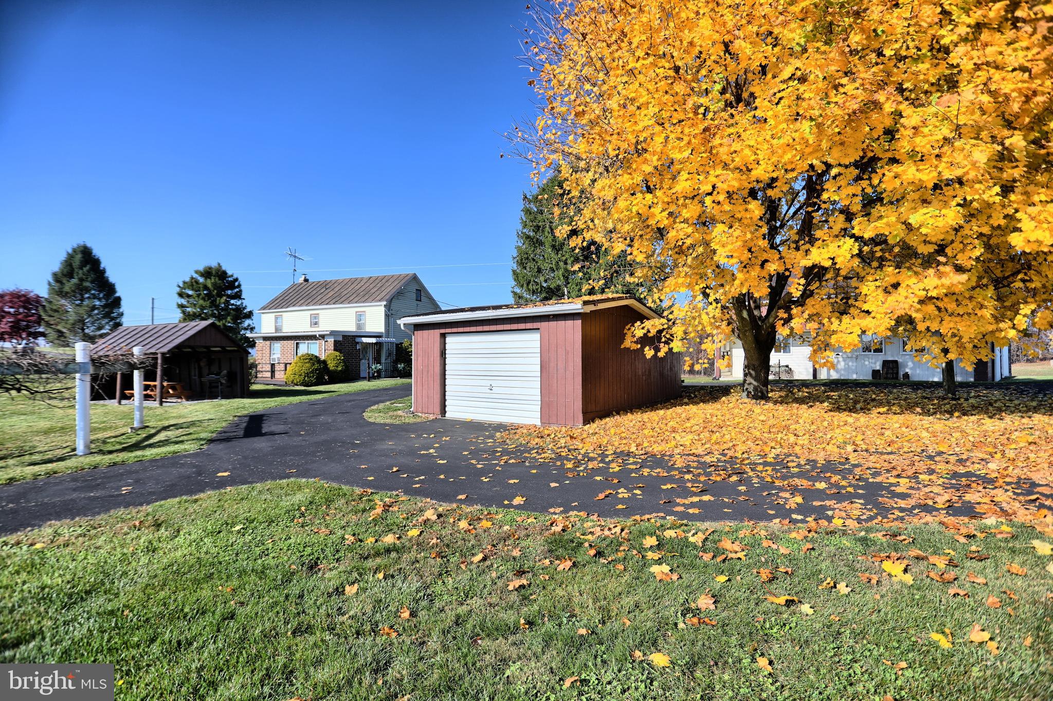 231 Mohawk Road Newville, PA 17241 - Photo 49 of 72 a front view of a house with a yard and garage