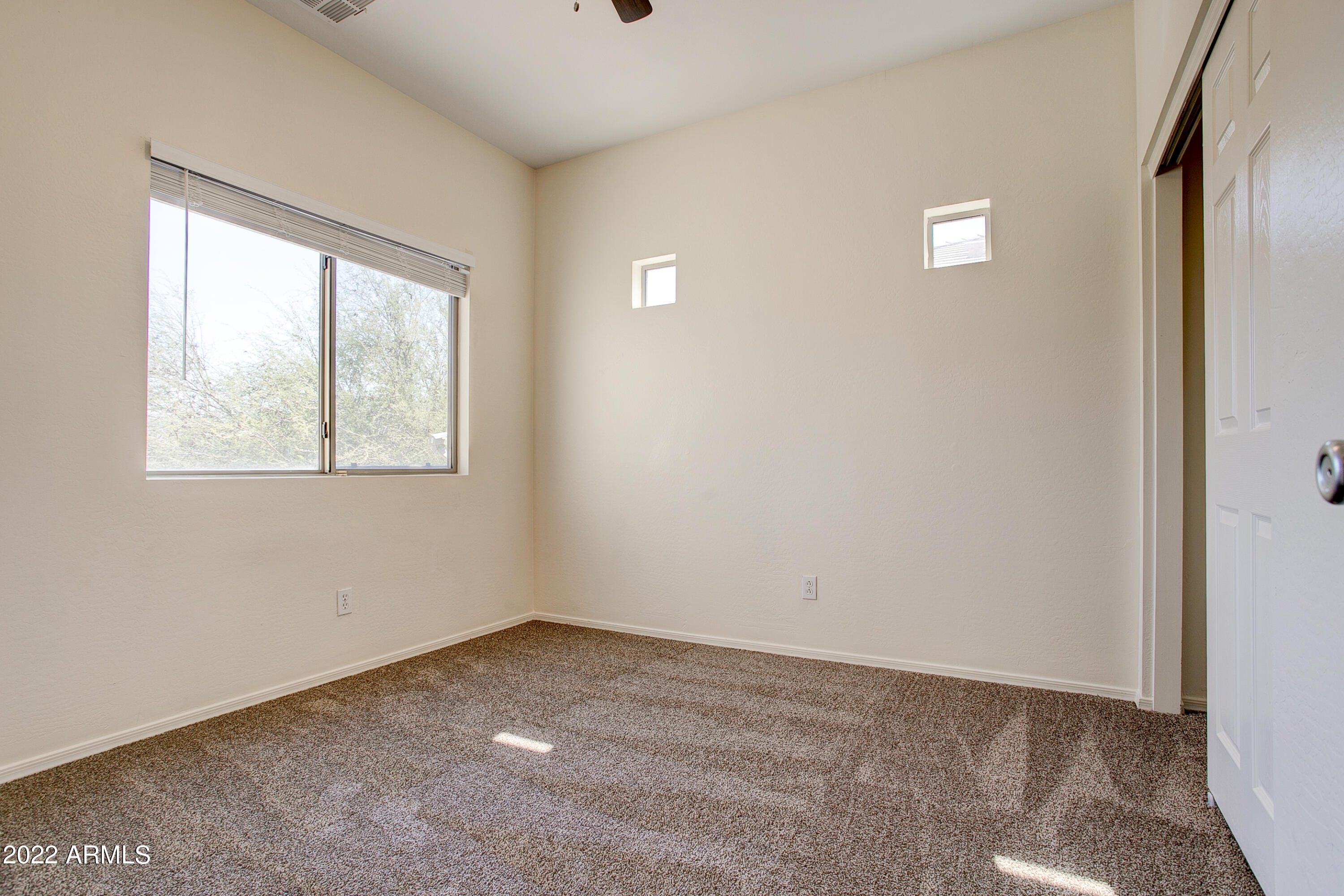 9928 West Chipman Road Tolleson, AZ 85353 - Photo 20 of 42 a view of an empty room with a window
