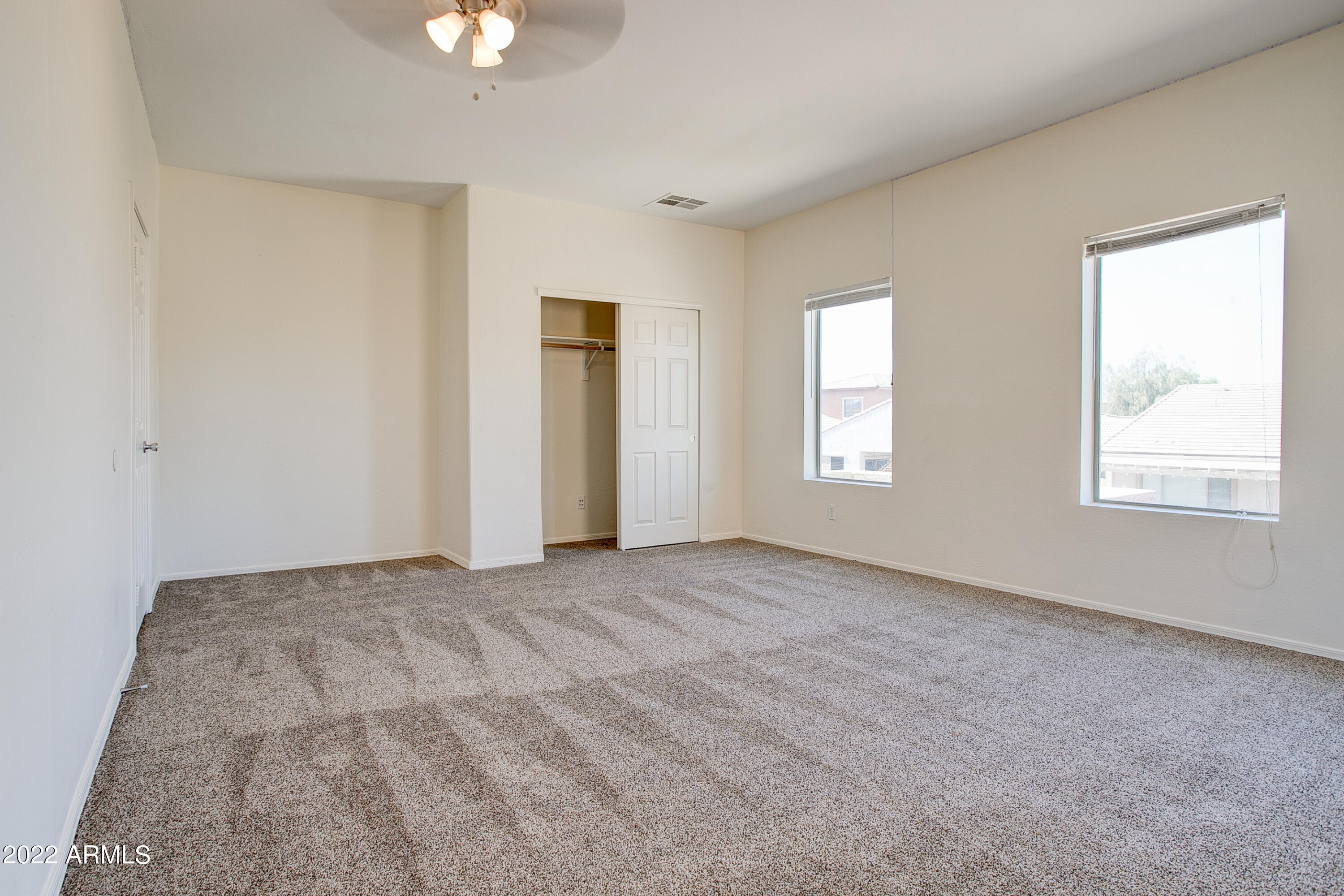 9928 West Chipman Road Tolleson, AZ 85353 - Photo 30 of 42 a view of an empty room with a window
