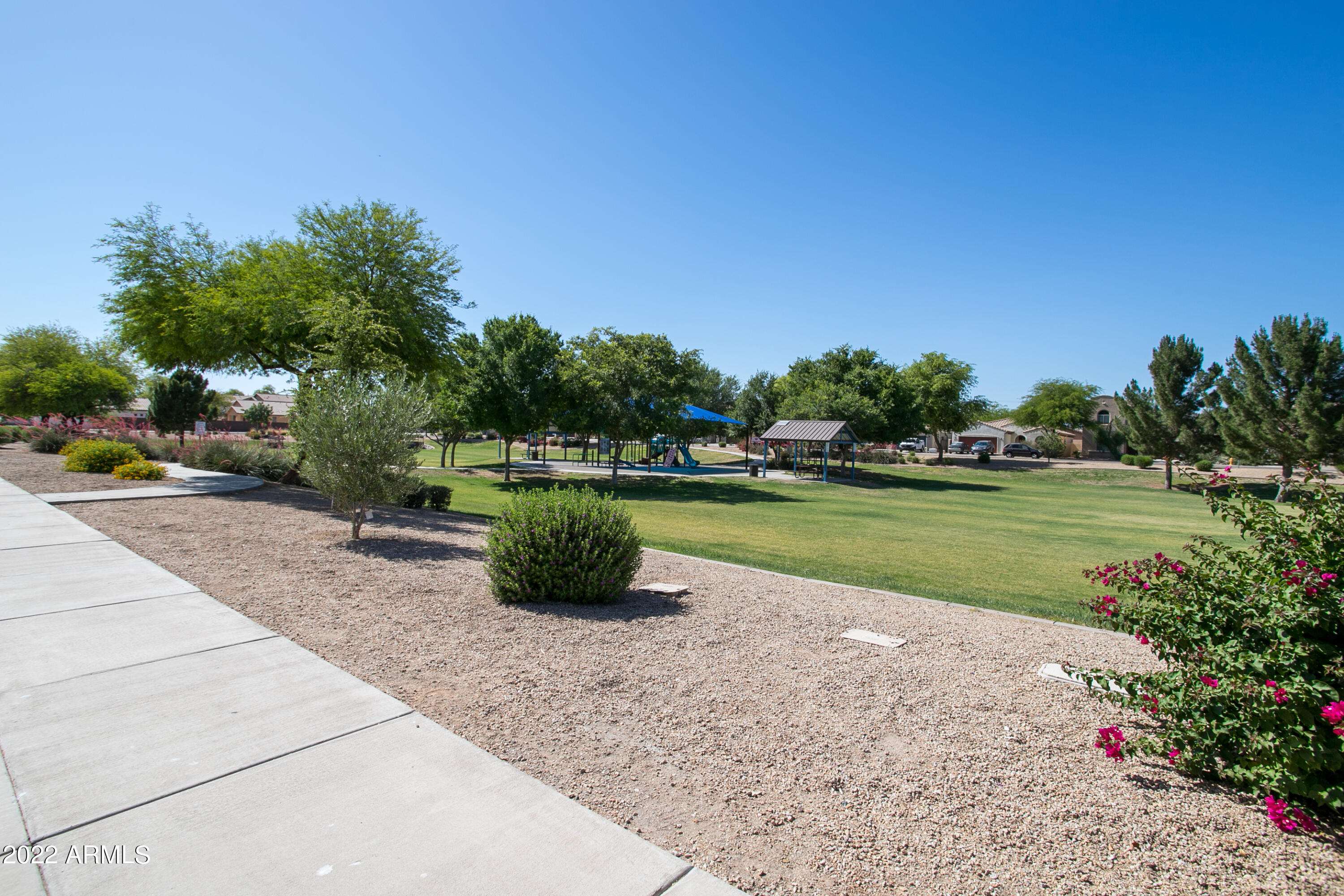 9928 West Chipman Road Tolleson, AZ 85353 - Photo 37 of 42 a view of a garden with a lake