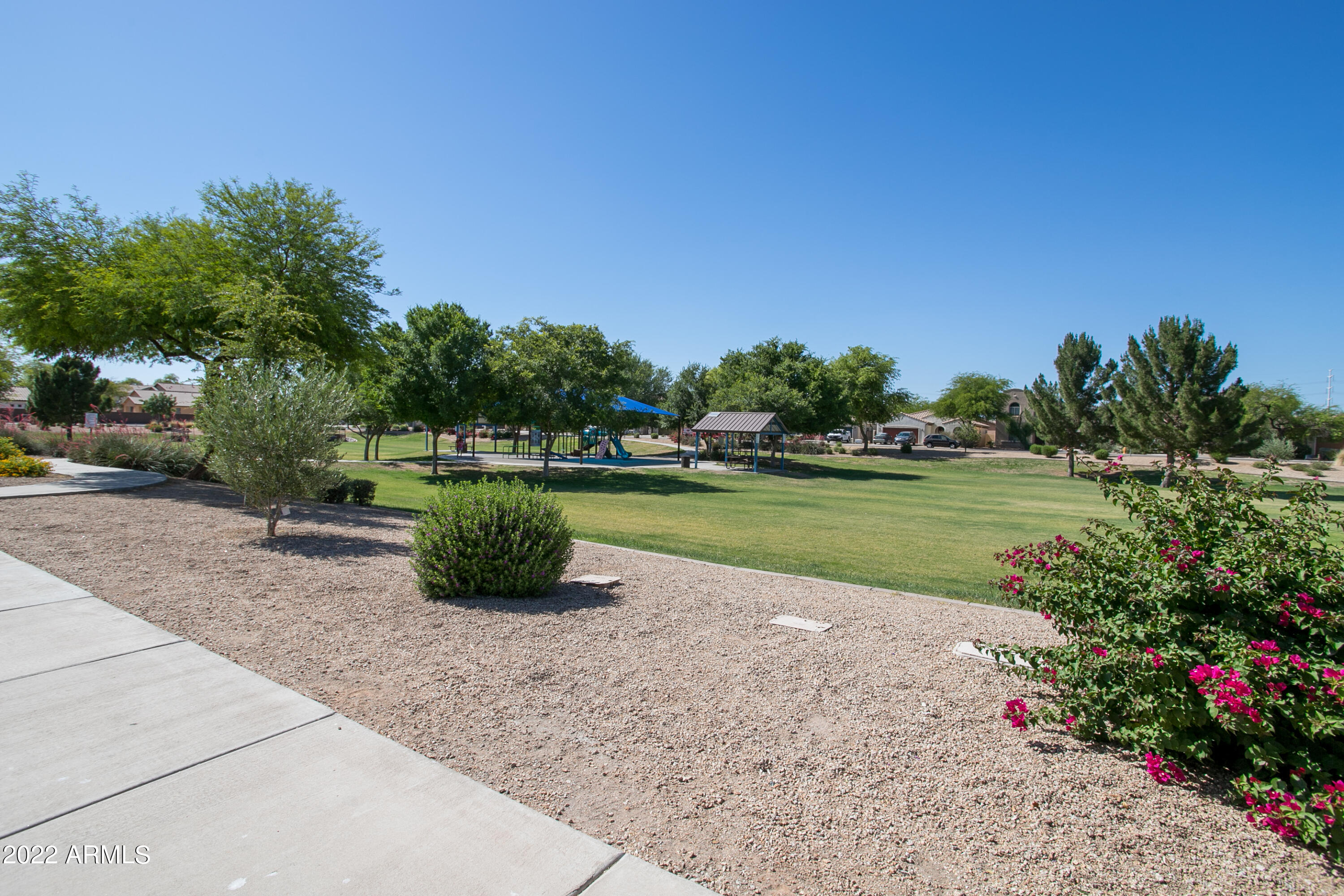 9928 West Chipman Road Tolleson, AZ 85353 - Photo 38 of 42 a view of a garden with a fountain